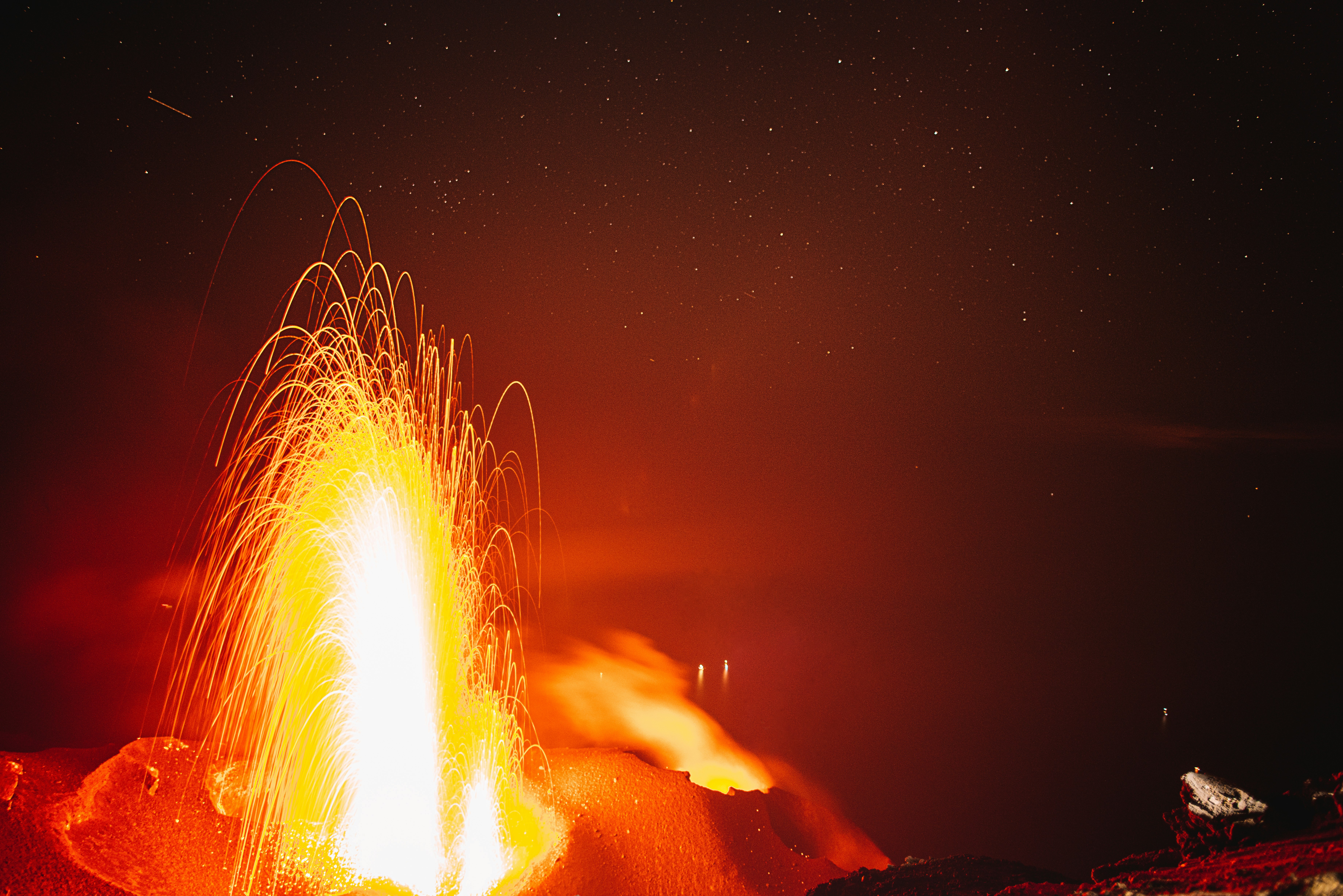 fire in the sky during night time